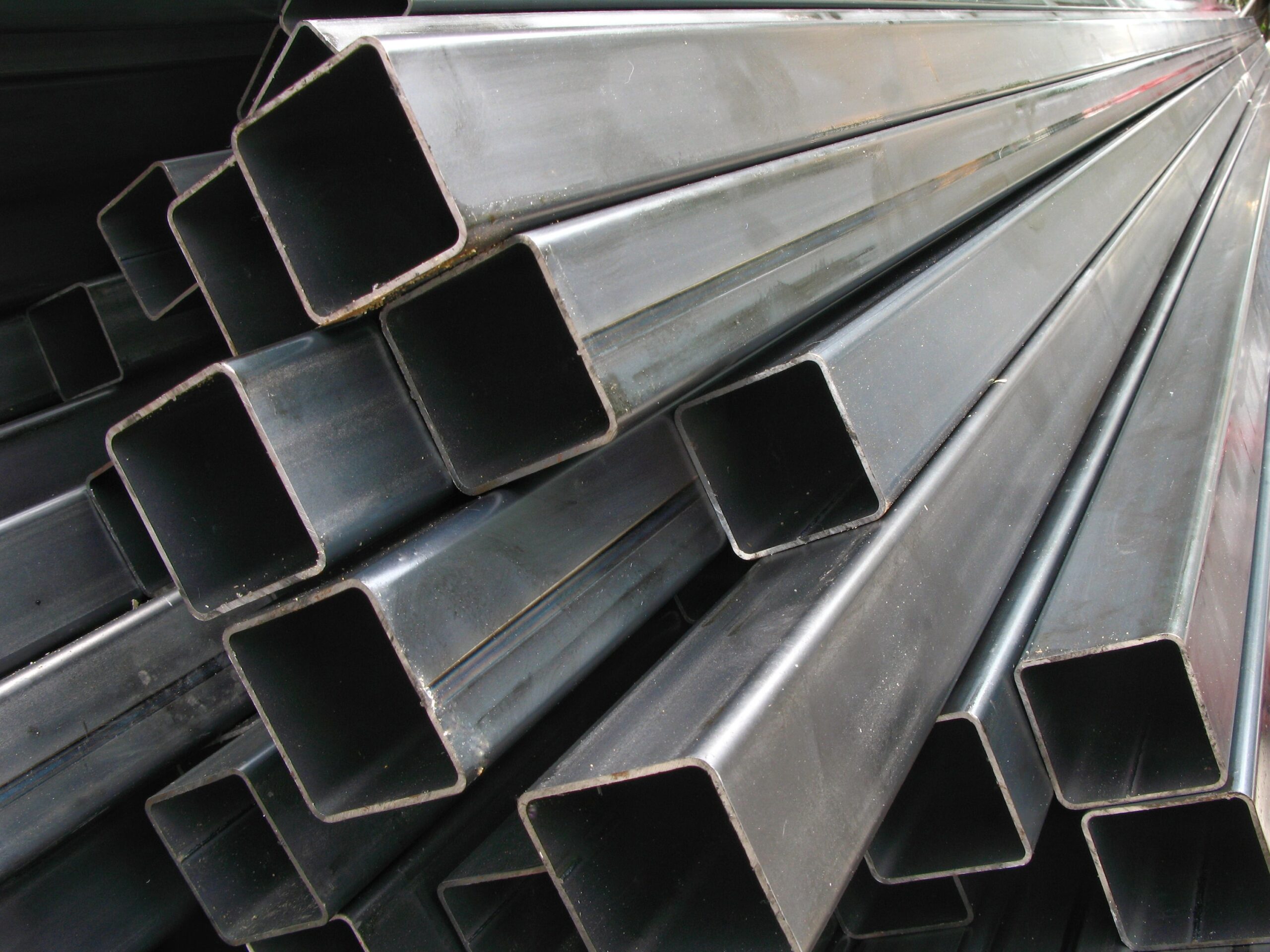 close up of square steel pipes stacked