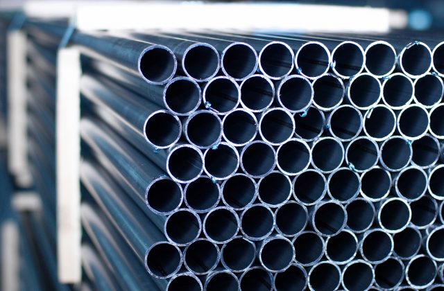 Steel pipes stacked in facility